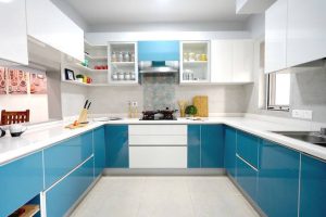 U-shaped modular kitchen with island in Kottayam home interior design